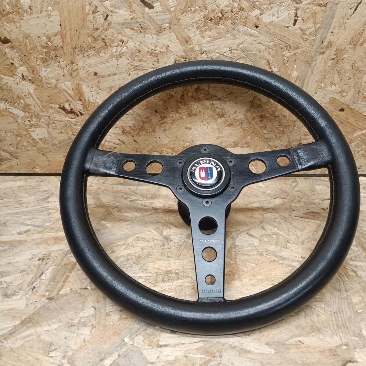 Alpina 3-spoke leather steering wheel with drilled spokes and Alpina badge, KBA 70064